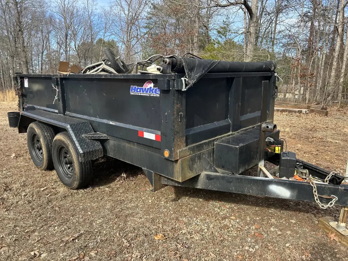 Loaded dump trailer full of household junk ready for haul-off